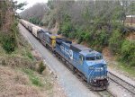 CSX 7323 leads a grain train held at Rice Street